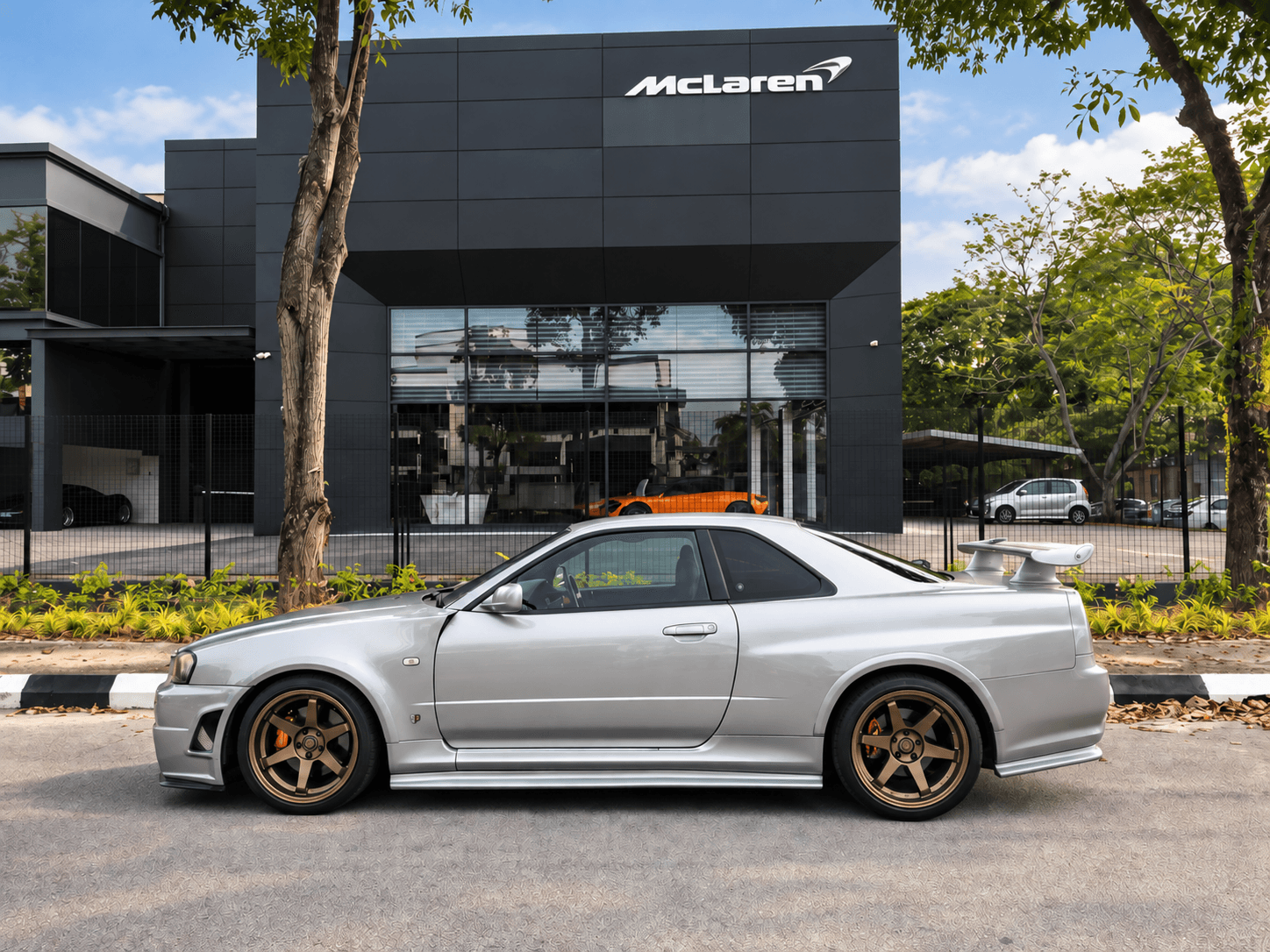 Silver Nissan Skyline GT-R R34 side profile with bronze wheels